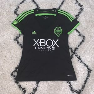 Women’s size L sounders soccer jersey. Used.